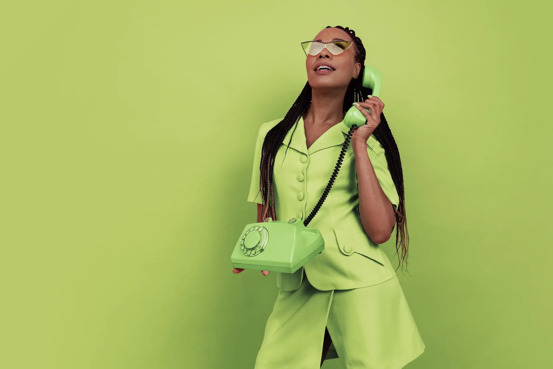 Woman using a rotary phone