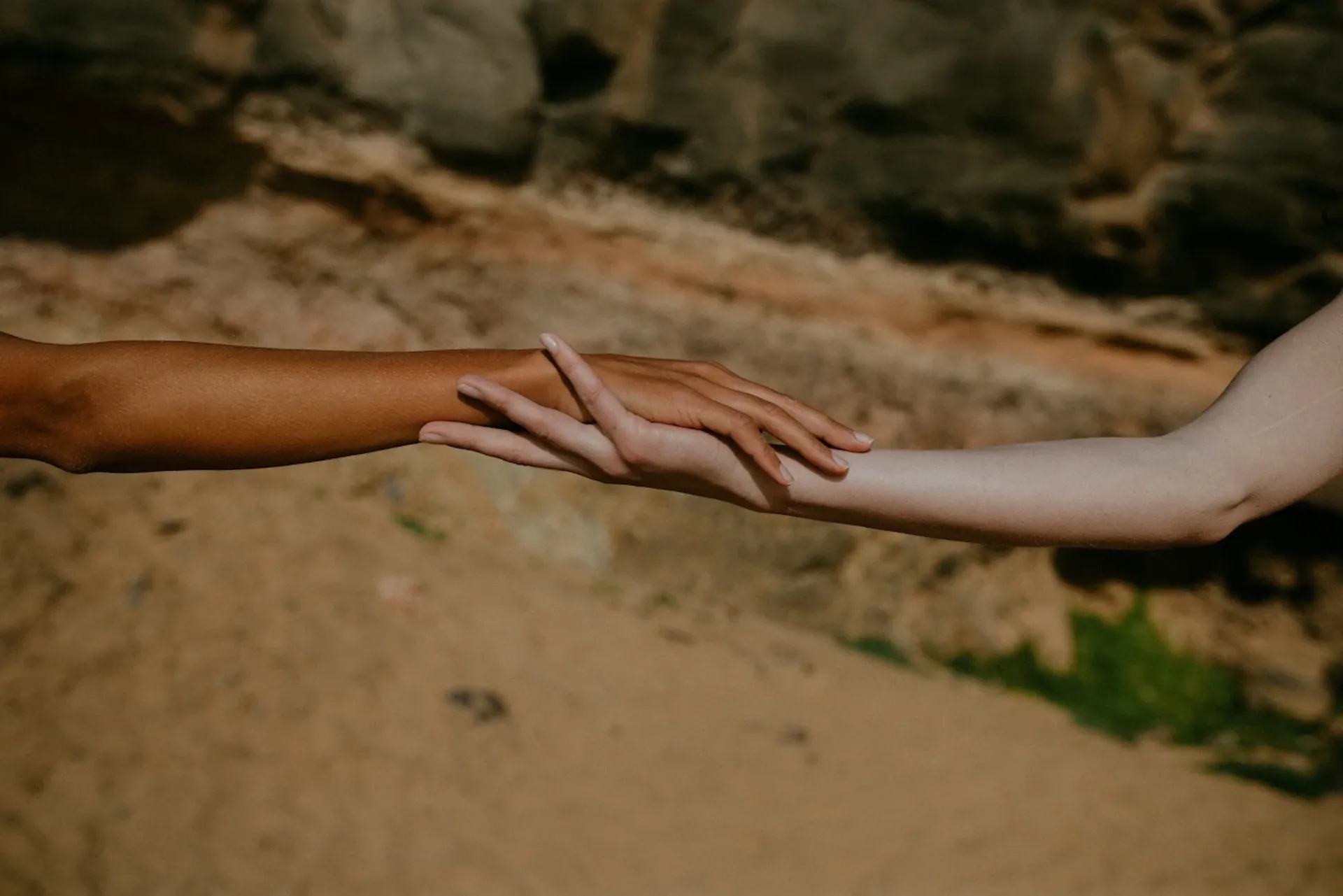 Two hands joining together